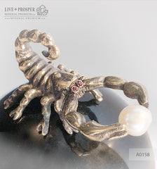 Bronze figure of scorpion on a Chrysoberyl sphere with sea pearl and Swarovski inserts on dolerite plate extra small Бронзовый скорпион на сфере из кошачьего глаза с морской жемчужиной и вставками из Сваровски на пластине из долерита -малый